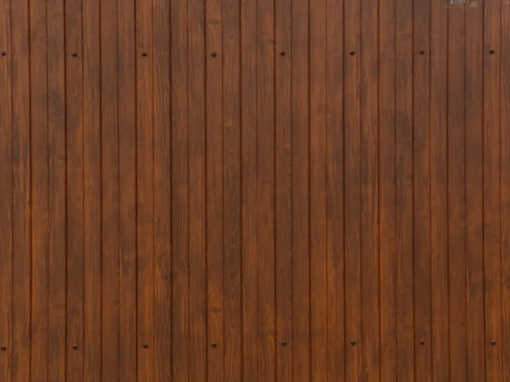 Wall of deep brown vertical wooden panels