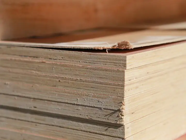 Stack of plywood boards showing their layered edges